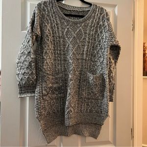 Long sweater with front pockets